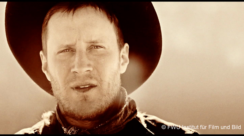 Szenenbild aus „Filmanalyse“: Beispiel für Naheinstellung mit Cowboy